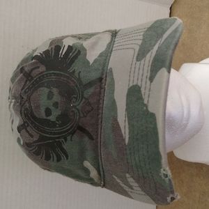 VGUC. Distressed camouflage skull baseball cap.